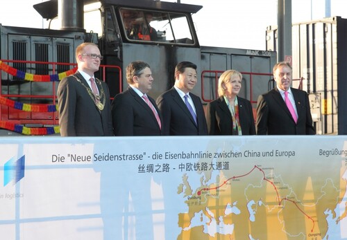 Figure 1. Transformative conjuncture: key actors celebrating the EU–China transcontinental rail connection in Duisburg, 29 March 2014: (from left) Lord Mayor of the city of Duisburg, Sören Link; Vice Chancellor of Germany and Economy and Energy Minister, Sigmar Gabriel; President of China, Xi Jinping; Prime Minister of the German State of North Rhine-Westphalia, Hannelore Kraft; and chief executive officer (CEO) of Duisburger Hafen AG (Duisport), Erich Staake.Note: The roles of these actors refer to the official positions they held at the time the photograph was taken.Source: © Duisport/Rolf Köppen, reproduced with kind permission.