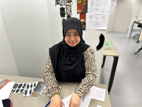 Figure 15 Nagheem Jasim started in Igne:Oya and continued in formal education in textile design in 2022. Here photographed in class at University College Copenhagen. Photo: Anne Sørensen.