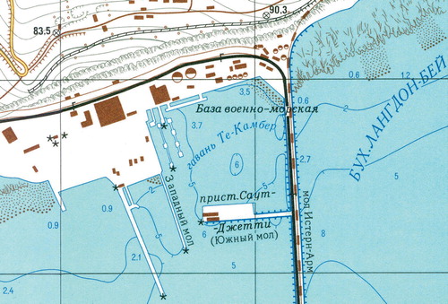 Figure 3. An extract showing Camber Dock within Dover harbour, which includes depictions of a dismantled railway running east-west above the cliffs and an aerial ropeway to transport coal via a tunnel down through the cliffs and along the eastern harbour arm.