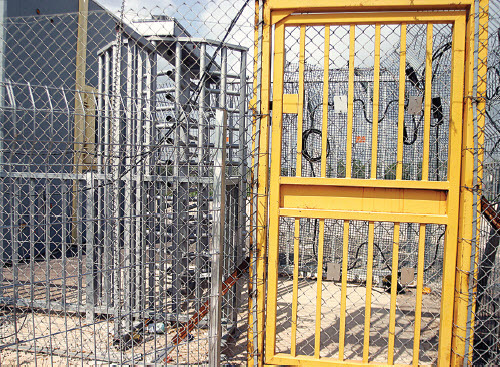 Figure 6: West Bank, Palestine, 2005 Israel’s wall in Palestinian agricultural areas is made up of a triple-layer fence, with barbed wire along the top and sides, patrol roads on both sides, and a series of gates. Palestinians with agricultural land on the other side of the wall are required to apply for permits in order to cross.