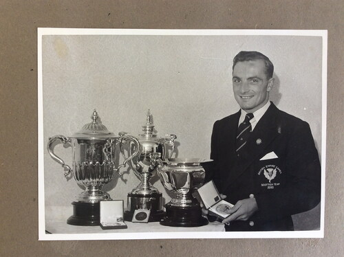 Figure 3. Heatly with 1950 gold medal and trophies.