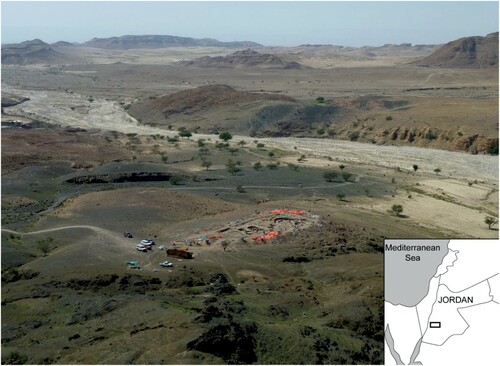 Figure 1 WF16 in southern Jordan: looking west along Wadi Faynan to the Wadi Araba, with the site of WF16 under excavation in April 2010 (photo: S. Mithen).