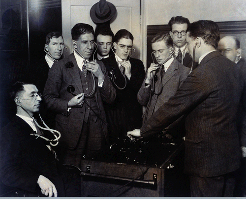 Figure 1. Medical students or doctors listening collectively to their own bodies using an electrical stethoscope. Photograph attributed to Central News, 1920s. Wellcome Library, London, Ref. L0029039.