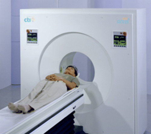 Figure 13 A patient undergoing a PET scan, showing the circular detector around the patient (http://www.samc.com/UMAP.asp?ID = 888).