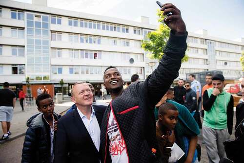 Figure 7. The centre-liberal former Prime Minister, Lars Løkke Rasmussen, on a visit to Vollsmose in 2015 ‘to have a chat with the residents about the values of the Danish society’. Photo: Jens Astrup. (https://www.flickr.com/photos/49542087@N05/18680288665. Creative Commons Attribution-non-commercial-NoDerivs 2.0 Generic (CC BY-NC-ND 2.0). Accessed 17 December 2020)