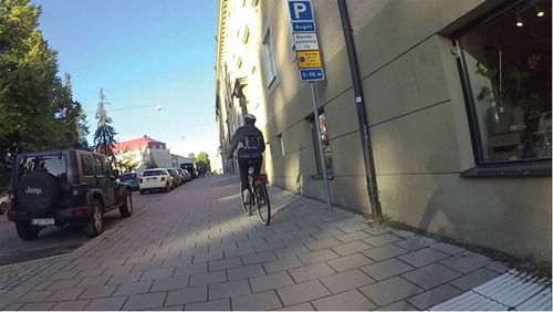 Figure 3. Participant riding on the pavement. Screenshot from the following experimental leader’s handle-bar mounted camera in Field Study 2