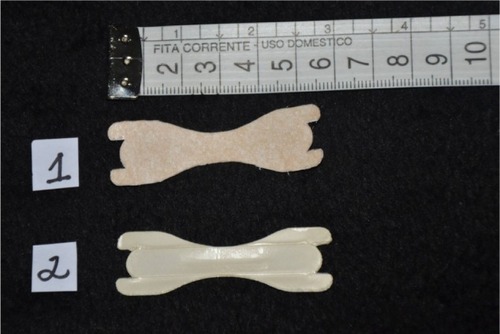 Figure 4 Placebo external nasal dilator strip (1) and experimental external nasal dilator strip (2) used by Dinardi et al.Citation33