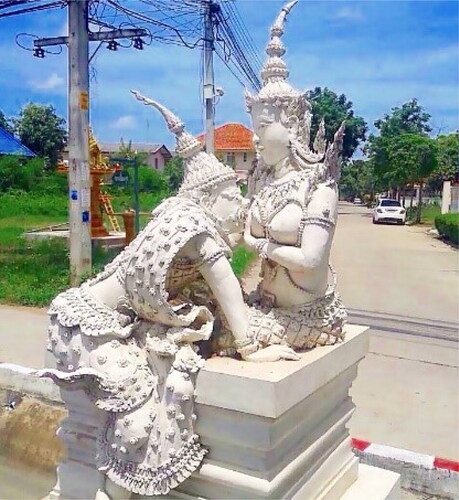 Figure 1. The sculpture of Ramakien in Petchaburi, Thailand portrays the moment when Mandodari feeds holy milk to Indrajit. This image depicts Mandodari unclothed and leads to the folk idiom that she possesses one unusually large breast.(Source: Misc.today, Citation2020).