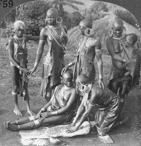 Figure 4.  ‘Grinding corn—Kikuyu women decorated with beads and brass wire—Mt. Kenia district. E. Africa’ [#10544/Keystone from U&U].