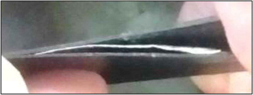 Figure 2. Aluminium sheet (3 cm × 3 cm) fitted within the carbon fibre layer.