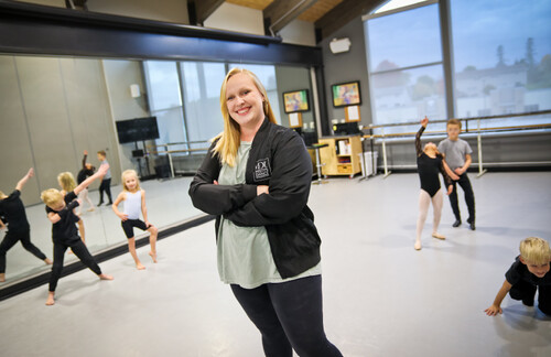 Teacher Kaydra Moses stops to pose for a smile as she leads an early elementary class through a playful freeze dance. Photo by Megan McCluskey, Misty’s Dance Unlimited, Onalaska, Wisconsin.
