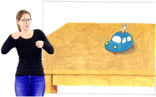 Figure 1. Presenter reading the picture books aloud and performing key word signing Note. Illustration by Maar (Citation1998). Video by Meike Cruz Leon.