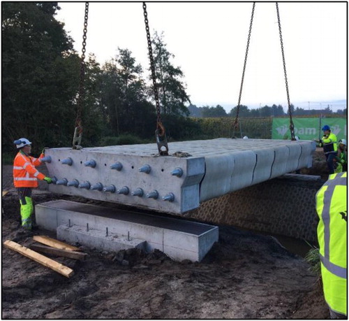 Figure 18. Hoisting the bridge into position.