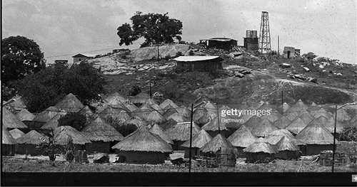 Image: Protected Village No. 10, Rhodesia- This protected village stands alone in the Chiweshe Trust Land North of Salisbury. The village, a sea of thatched roof huts, is ringed with barbed wire and security lights. On the hill above the huts is the tower, where security forces keep watch and fight off night guerrilla attacks. Source gettyimages.co.uk