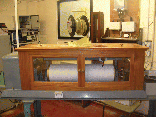 Figure 7. The Munro tide gauge installed in 1983 and located above the stilling well. The white L-piece on the front of its frame is the Contact Point from which dipping measurements are made in order to confirm that the gauge is recording to the correct datum. The dipper itself is shown on top of the gauge. (Photograph Les Bradley)
