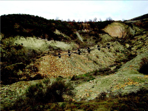 Figure 4. Flank ridge in the middle part of the source area of the earth flow. Linework shows the topographic crest of the ridge. Distance across the photo from left to right is about 150 m.