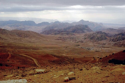 Figure 14 The Baydha region (at the center of the picture), seen from the Shara Mountains (in the foreground) and with Petra in the background (photo by M. Sinibaldi).