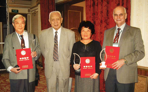 1. In November 2012, the Chinese Society of Forestry acknowledged outstanding contributions to China eucalypt development and presented awards to three Chinese scientists and two Australian foresters, Dick Pegg and Stephen Midgley. At the presentations (left to right): Wei Ju (former Manager of Dong Men Forest Farm and counterpart, mentor and friend to many Australian foresters), Qi Shuxiong (the ‘grandfather’ of eucalypts in China, author and founding Director of the China Eucalypt Research Centre), Hu Tianyu (long-term leader of eucalypt introduction to Sichuan) and Stephen Midgley RPF.