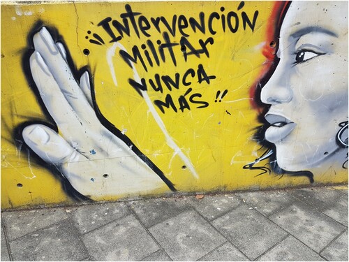 Figure 4. Mural in the Comuna Trece in: ‘Military Interventions, Never again.’ (Author, October 2017).