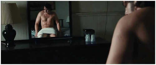 Figure 2. No Country for Old Men shows Bardem undressed (and again framed in a mirror) as his Anton Chigurgh character tends to his wounds. Miramax Films/Paramount Vantage, 2007.