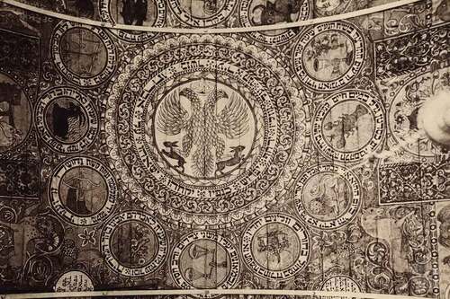 Figure 5. The original ceiling of the wooden synagogue in Khodoriv; zodiac. Black and white photography by Alois Breyer (1885–1948) between 1905 and 1912. Retrieved from public domain https://commons.wikimedia.org/wiki/File:Wooden_synagogue_in_Khodoriv,_zodiac.jpg#/media/File:Wooden_synagogue_in_Khodoriv,_zodiac.jpg on the 6th of April, 2022.