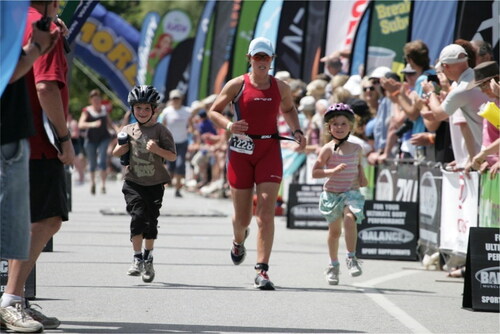 Figure 1. This photo shows Lucy running to the finish flanked by her two children.Source: Authors.
