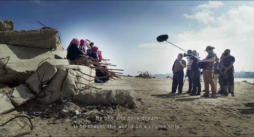 Figure 1. A shot from Human Flow showing Ai Weiwei (centre) and crew filming interviews in Gaza.