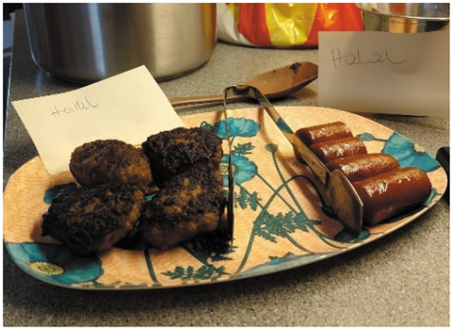 Photo 2. Meat balls and sausages. The plate has a note stating ‘halal’.