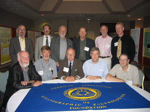 Figure 3. Geoff Norris with fellow Past Presidents and President of the American Association of Stratigraphic Palynologists, taken at the 36th Annual Meeting in St. Catharines, Ontario, Canada, 2003. Standing left to right: John Wrenn, Fred Rich, Doug Nichols, Dave Pocknall, Reed Wicander, and Jim Riding (then President); seated left to right: Geoff Norris, Jan Jansonius, Al Traverse, Bob Clarke, and Don Benson. Photo: another Past-President, Vaughn M. Bryant, Jr.