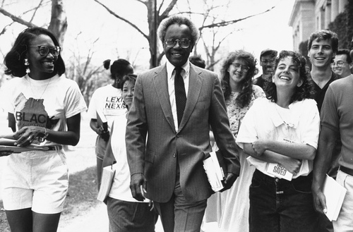 Figure 2. Harvard Law School professor Derrick Bell (center) walking with a group of law students on campus after taking a voluntary unpaid leave of absence to protest the law school’s practice of not granting tenure to minority women professors. Photo by Steve Liss/Getty Images.