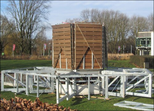 Fig. 6: Module 1 (filled with 1 m3 of concrete and 1000 kg of steel); Module 2 (with a 3000 kg- BESS), and some of the main and secondary trusses previously installed. Platform panels are folded over module 2