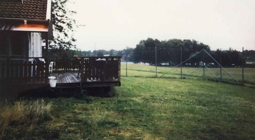 Photo 8. Photo taken by a young female showing the department’s fenced back with patio and lawn