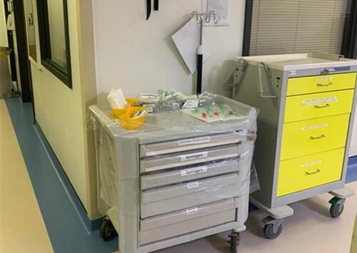 Figure 4 Carts placed outside the negative pressure room containing anaesthesia and PPE equipment.