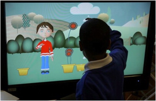Figure 1. A child playing with ECHOES on a big multi-touch screen.