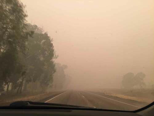 Figure 1. Becoming vulnerable, becoming complicit. Bushfire smoke visible from the dashboard of my fossil-fuelled car, as I drove the 850 km from my parents’ house in Bendigo to Sydney, on 5 January, after my summer holiday. The smoke was this thick for almost the entirety of that trip, as it had been when I made the original trip south on December 22. Image: Author.