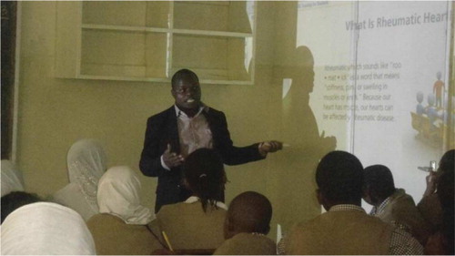 Fig. 4 Young professional using an interactive module to conduct RHD training at Bellevue Primary School, Nairobi, Kenya.