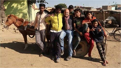 FIGURE 13. Filmmaker Michael Brown with equine handlers, Nepalganj, Nepal.