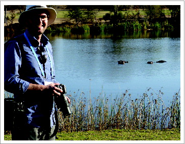 Figure 3. Boris Kingma, the first-prize winner of the competition for the Temperature Young Investigator Award for the Best Paper on Thermal Physiology in a Changing Thermal World. In the photo, Boris is at the Skukuza Golf Club (Kruger National Park), while attending the 2014 PPTR meeting. The brown objects in the water are actually hippos. “Golf among the hippos” is mentioned in the report on the meeting by Tanya Swanepoel and Anna HawCitation2 in the current issue. Photo courtesy of Boris Kingma.