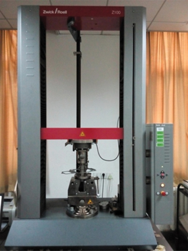 Figure 2. Experiment on the compressive-resilient performance of cylinder gasket.