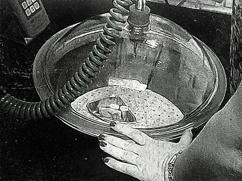 Figure 11. Jens’ scientist is demonstrating how to use the vacuum pump.