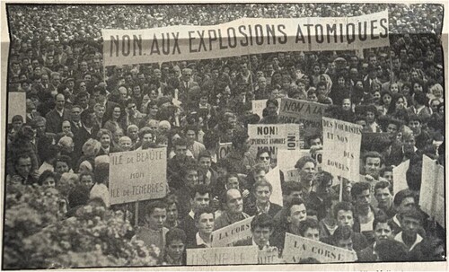 Figure 2. The large banner, unfurled during Ajaccio’s strike and protest on May 3, 1960, reads, “No to atomic explosions.” Another banner reads, “Tourists and not bombs.” “A l’issue de l’entretien avec M. Debré  … ” [Following the conversation with Mr. Debré], Insulaire, May 16, 1960. Used with permission of Nice-Matin.