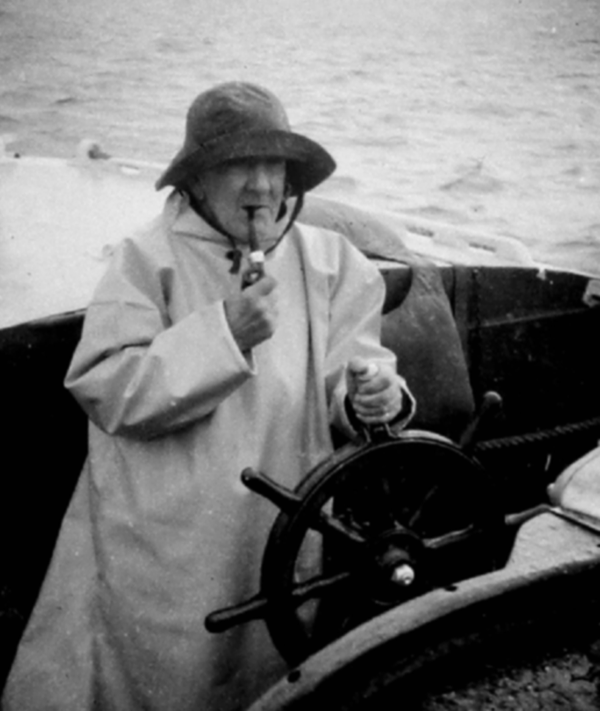 Figure 8. Graham Brown at the wheel of his converted lifeboat, Thekla, in about 1960. Used with permission of the Trustees of the National Library of Scotland.