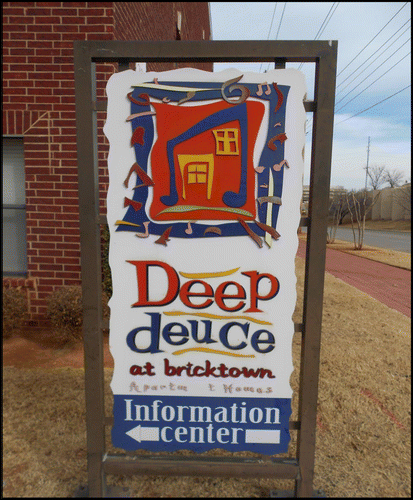 Figure 5. Sign advertising the Deep Deuce at Bricktown Apartments and Homes. Photo by Adam A. Payne, 2014.
