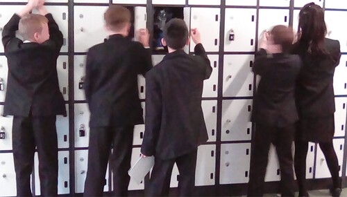 Image 5. A group of students in front of the lockers.