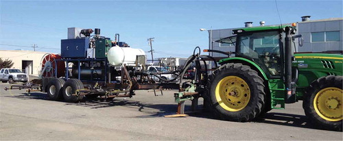 Figure 4. New steam applicator design with the direct fire steam applicator—tractor towed, with the direct-fired steam generator on the towed wagon and shanks to inject the steam in the soil.