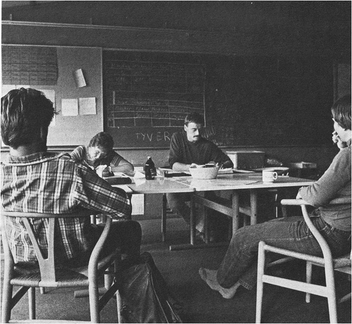 Image 2.A group of PLYS teachers holding a meeting about the clusters of classes around one of the central rooms. During the first decade of the school's existence, the teachers generally spent a fair amount of time developing and coordinating every day school activities and discussing the overall development of their open plan pedagogy. The image is dated 1982. Photographer: Thomas A. Fog