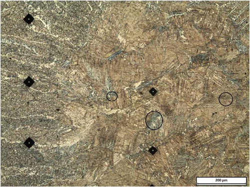 Figure 4. The as-welded microstructure of the FZ and HAZ of the sample welded perpendicular to the rolling direction. The microstructure of the CGHAZ is mainly composed of lath Martensite and elements of upper Bainite indicated by the small circles.