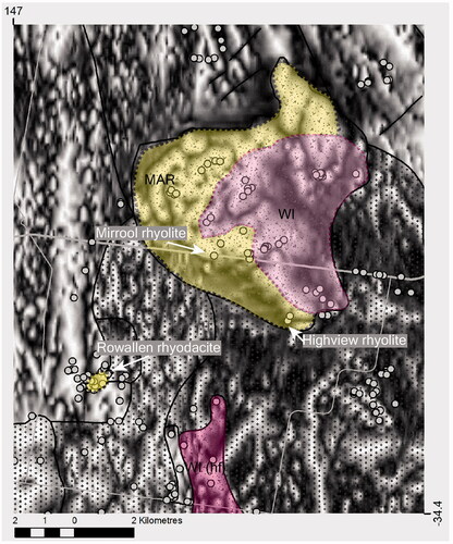 Figure 7. Mount Ariah Rhyolite ∼12 km east of Ardlethan (see Figure 2). Individual coherent rhyolites are distinguished by their mineralogy, texture and magnetic qualities as shown on this greyscale total magnetic intensity image, with tilt-filter applied; white represents relatively high magnetic intensity. Yellow is Mount Ariah Rhyolite (MAR), pink is Walleroobie Ignimbrite (WI). Darker pink on the south edge of the image is contact-metamorphosed WI (hf). Field sites are small grey circles.