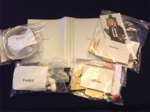 Figure 1. Sample set of materials sent to participating families. Note separately bagged kits for each task and toolkit, plus work mat.