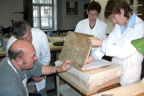 FIGURE 8. Christopher Clarkson in 2005 with Matjaz Casar, Darja Harauer and Blanka Avgustin Florjanovic, book conservators from the Archives of the Republic of Slovenia, during the conservation of parchment incunabulum ‘Institutiones Clementi’ printed by Fust and Schöffer during 1460 in Mainz.